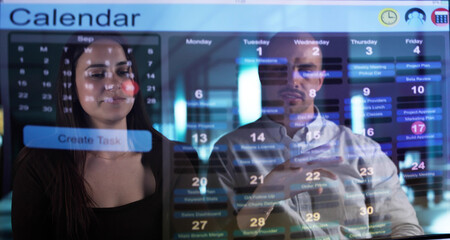 Tech-savvy Businessman Schedules Appointments On Transparent Calendar