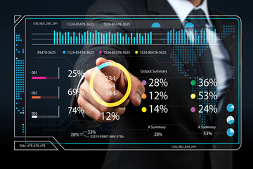 Business analytics dashboard with financial data visualization, person interacting with digital interface, graphs and statistics for decision making