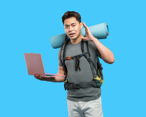 Adventurous hiker with laptop shares stories planning trips and connecting on a travel blog