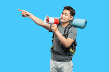 Enthusiastic Hiker Directs Attention with Megaphone and Point Prepared for the Adventure Ahead
