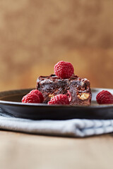 Piece of chocolate cake on rustic background. Close up.	