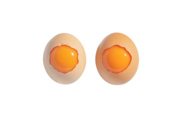 Two cracked eggs showing yolks isolated on transparent PNG
