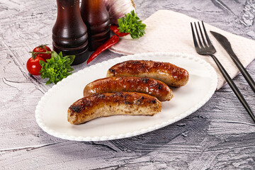 Delicous natural roasted sausages in the plate