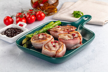 Tasty grilled pork medallion with bacon