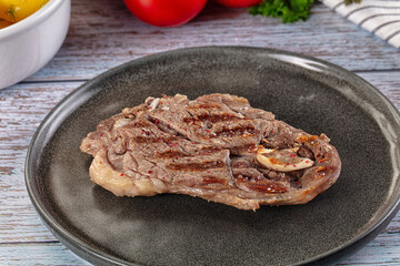 Grilled lamb steak with bone