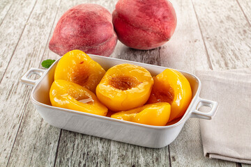 Sweet ripe yellow canned peaches