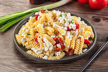 Italian pasta fusili with curd