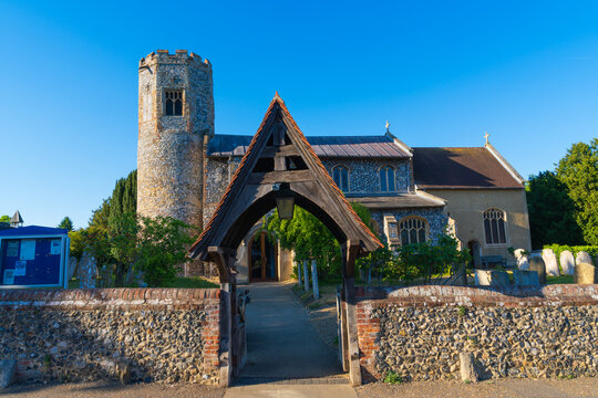 St. Margaret's Church, with a medieval flint tower and a wooden lych gate, in Norwich. Historic Anglican parish church showing traditional English ecclesiastical architecture