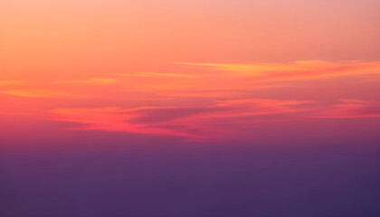 Stunning sunset sky with smooth gradient from soft orange to deep purple and glowing clouds