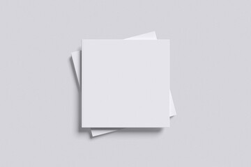 White front and back view of square book with grey background color for mockup template