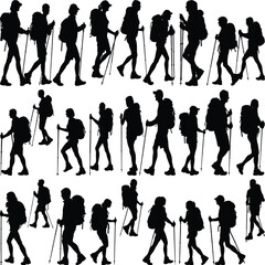Obraz premium Silhouettes of hikers with backpacks and trekking poles