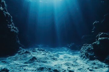Obraz premium Explore the serene underwater landscape with light rays illuminating the ocean floor at midday, Underwater background Photo