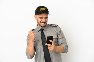 Young security  caucasian man isolated on white background with phone in victory position