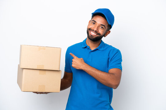 Delivery Brazilian man isolated on white background pointing back