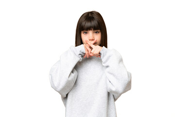 Little girl over isolated green chroma key background showing a sign of silence gesture