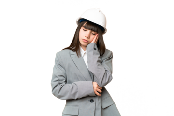 Little girl playing as a architect with helmet and holding blueprints over isolated background with headache