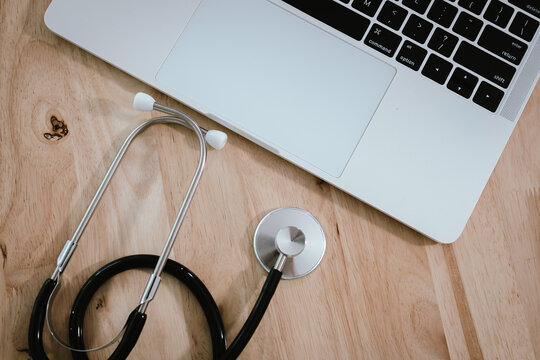 Closeup of a doctor using a stethoscope during a patient exam, highlighting professional medical care, diagnosis tools, and clinical equipment.