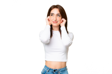 Young caucasian woman over isolated chroma key background frustrated and covering ears