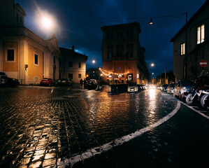 Night Rome streets during a rain