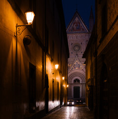 Duomo di Orvieto and narrow street at night