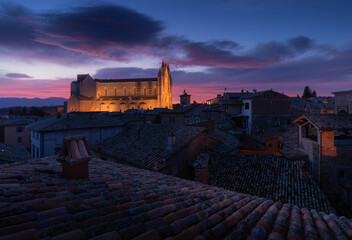Duomo di Orvieto at sunrise. Orvieto roofs from above