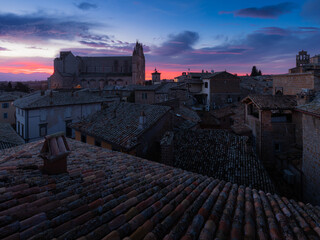 Duomo di Orvieto at sunrise. Orvieto roofs from above