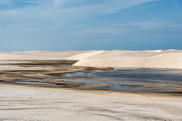 Dunes and lagoons of lagoa bonita, Lencois Maranhenses, Barreirinhas, Brazil. White sand dunes with...