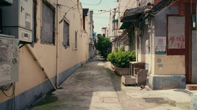 Tranquil walk through a sunny, disappearing part of Shanghai. A visual ode to fading urban heritage.