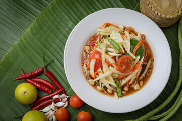 Classic Thai Somtam (Thai Somtam) served on a wooden table. Famous and refreshing menu The concept of authentic Thai food is very popular