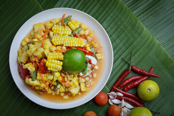 Classic Thai Somtam (Thai Somtam) served on a wooden table. Famous and refreshing menu The concept of authentic Thai food is very popular