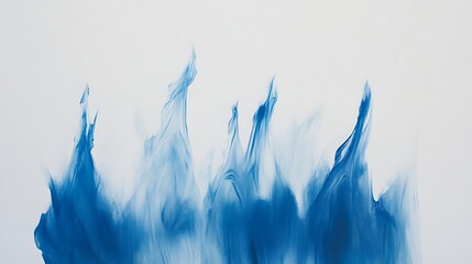 Abstract artwork depicting blue color gradients resembling flames on white