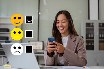 Woman holding a digital smartphone with checkboxes rating smiley faces excellent for Satisfaction...