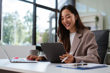 Businesswoman analyzing financial graphs, calculating company expenses, and planning investments,...