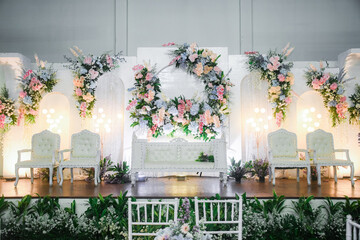 Beautiful wedding stage with flowers. elegant decoration background. A wedding venue is literally a location that will be used as a place for a wedding event to take place.