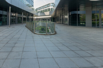 empty road in front of modern office building in the city