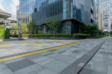 empty road in front of modern office building in the city