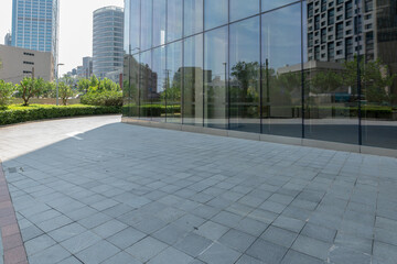 empty road in front of modern office building in the city