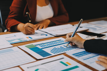 Group of business people brainstorming in analytical plan meeting Calculate the numbers obtained...