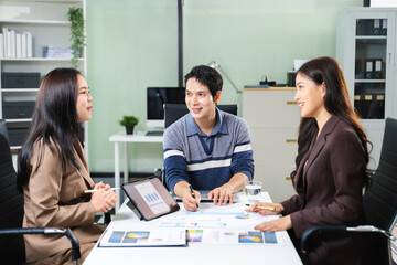 Group of Asian business meeting in planning design in creative business discussing work