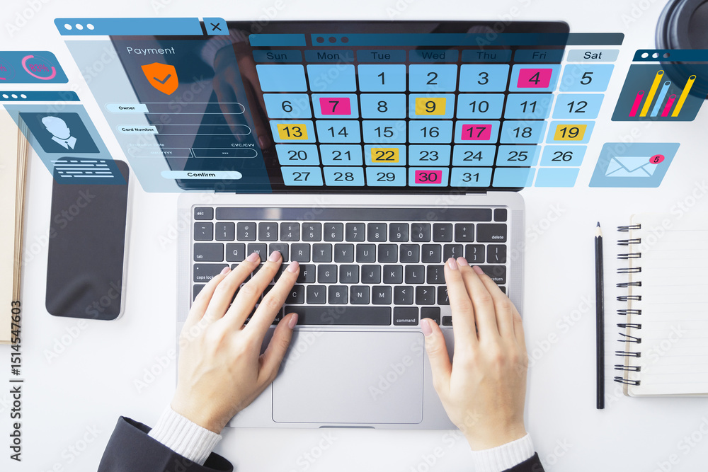 Poster Hands typing on laptop with digital calendar and virtual interface on office desk from top view perspective.
