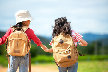 Group friend children travel nature summer trips.  Family Asia people tourism walking on road happy and fun explore adventure outdoors for leisure and destination, mountain background