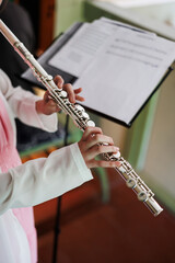 Young Musician Playing Flute at Practice Session
