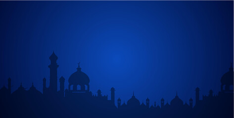 Silhouette of Islamic Mosques Against a Deep Blue Background © kholik