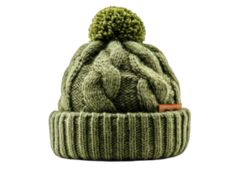 Olive green cable-knit beanie with a fluffy pom-pom atop, featuring a small rectangular label near the cuff.  The knit is thick and textured, suggesting warmth and comfort