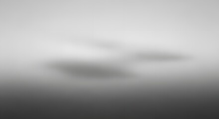 Abstract clouds gracefully suspended in a soft, atmospheric gray gradient. the soft, dreamy atmosphere invites viewers to contemplate the mysteries of nature. 