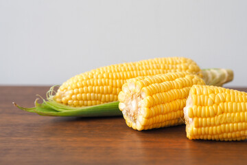 Fresh corn on wooden table background