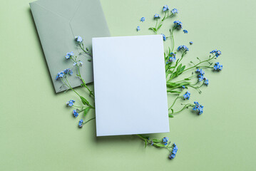 Greeting card and envelope design with blue forget-me-not flowers
