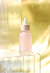 Studio composition featuring a pipette bottle and ribbed glass. Fashion-forward and clean aesthetic