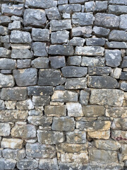Fototapeta premium Rough stacked stone wall background