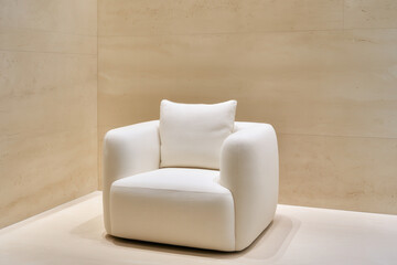 stylish armchair in clean minimalist environment featuring soft textures and neutral colors